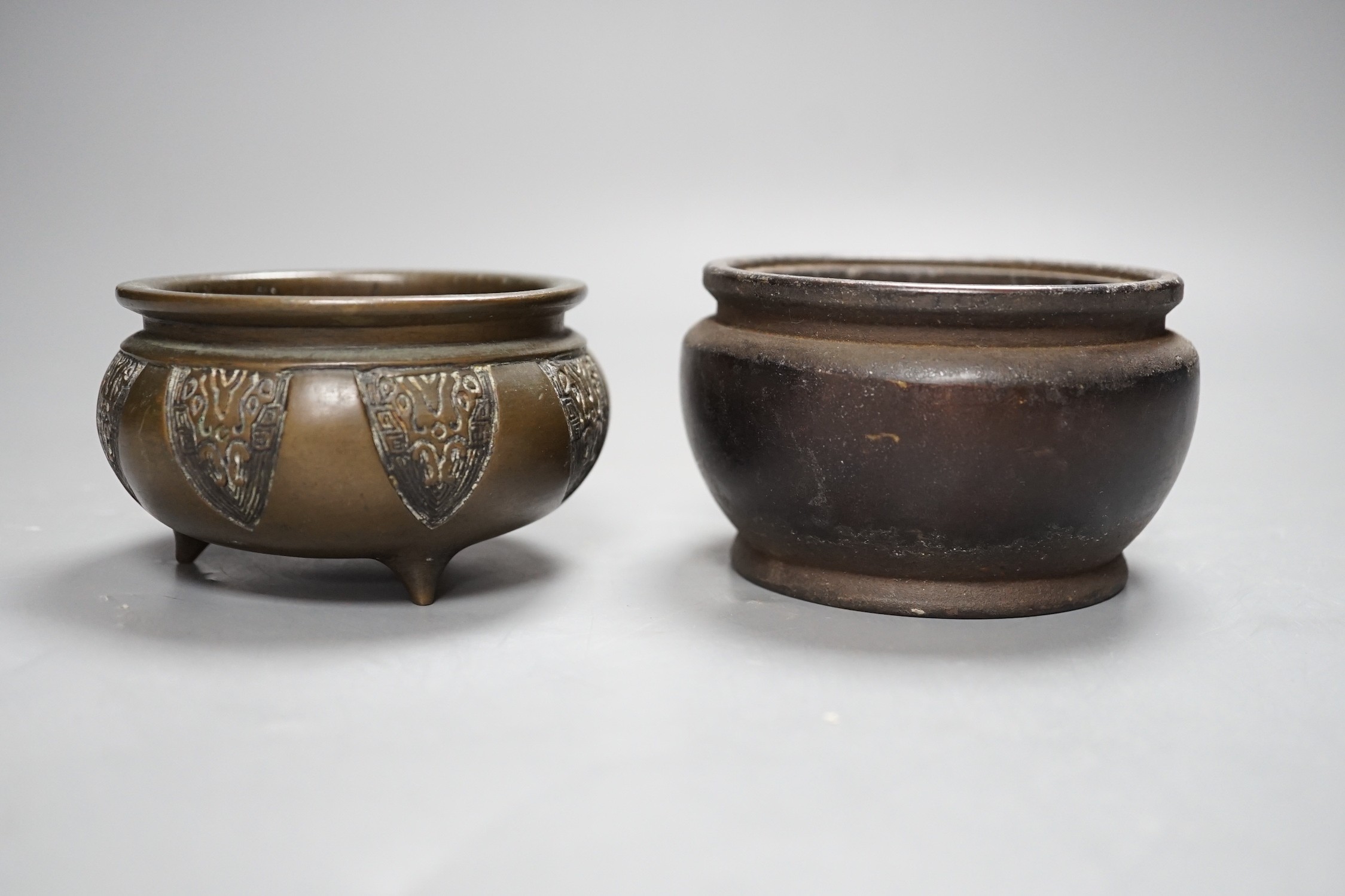 Two Chinese bronze censers, one inscribed, tallest 6cm